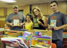 Photo of Alpha Chi Volunteers with donated books