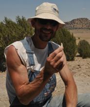 Mark Micozzi with theropod tooth
