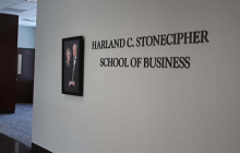 The sign to the entrance of the Harland C. Stonecipher School of Business