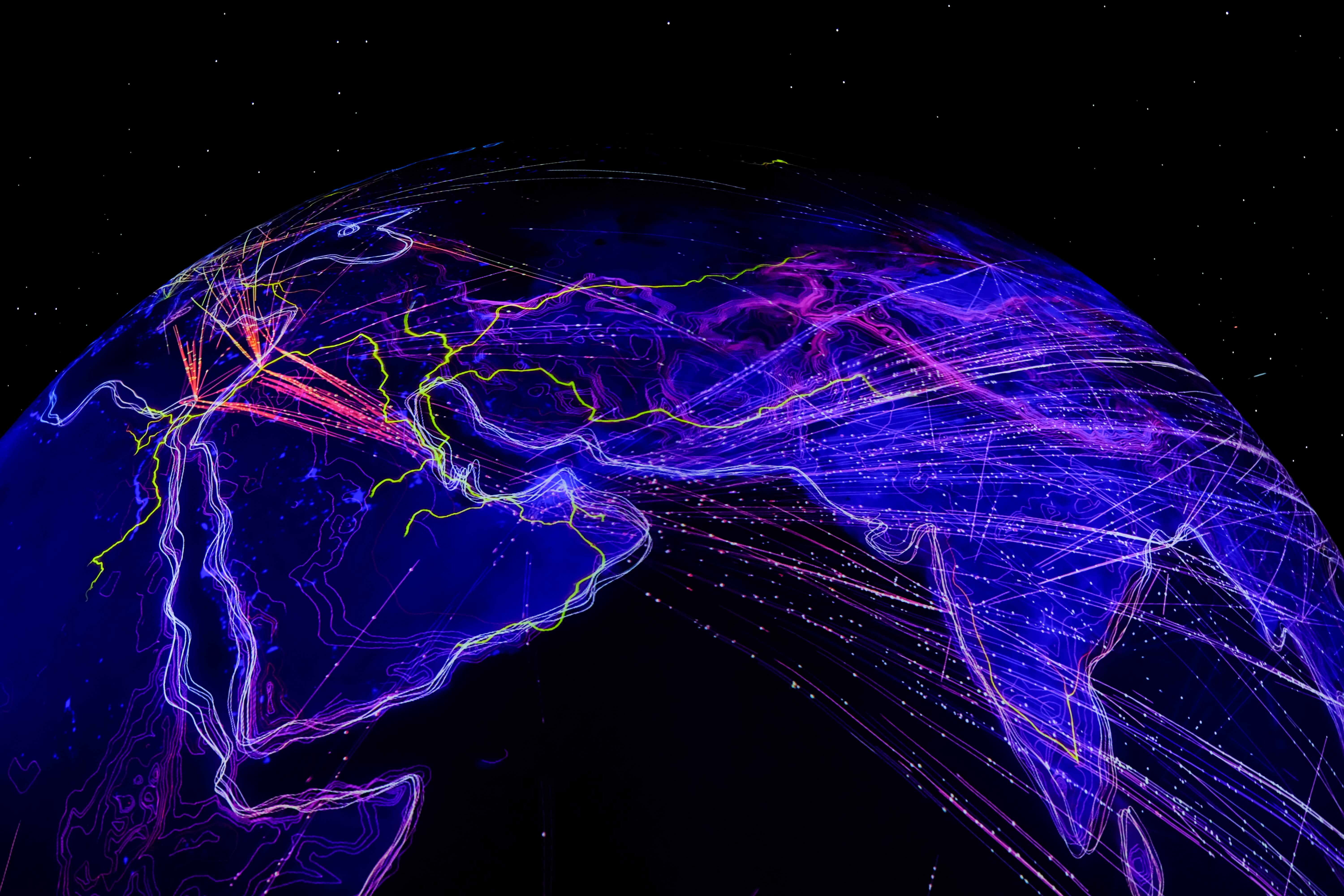A glowing stylized image of the Earth, highlighting global network connectivity
