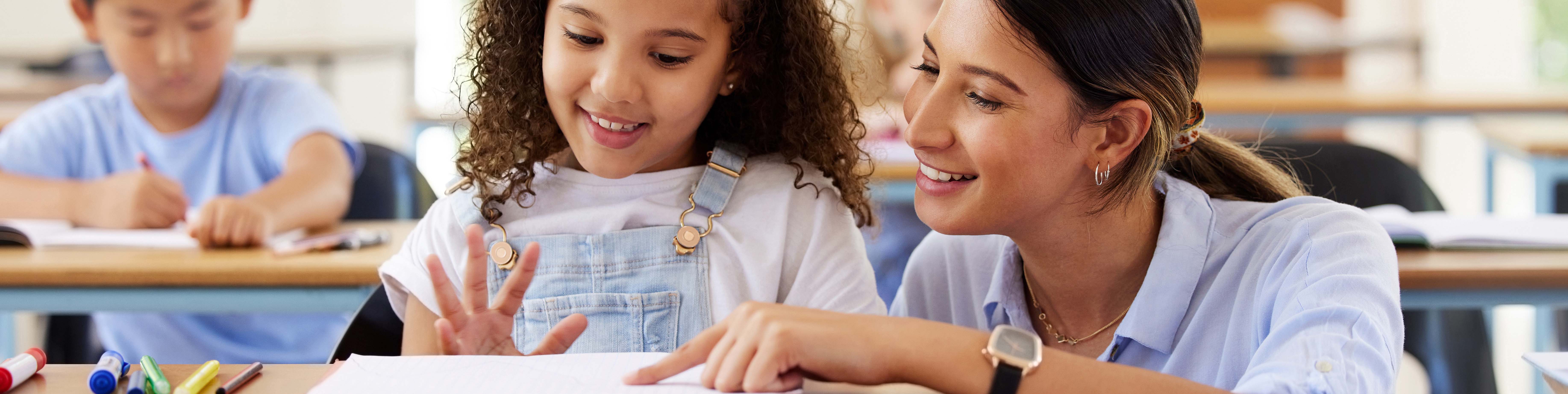 teacher helping student