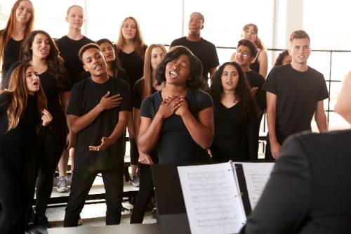 male and female student in choir