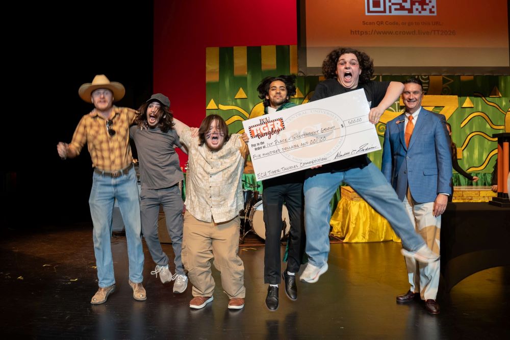 The Prozac Boys celebrating on stage