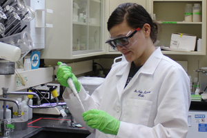 Woman in lab using instruments
