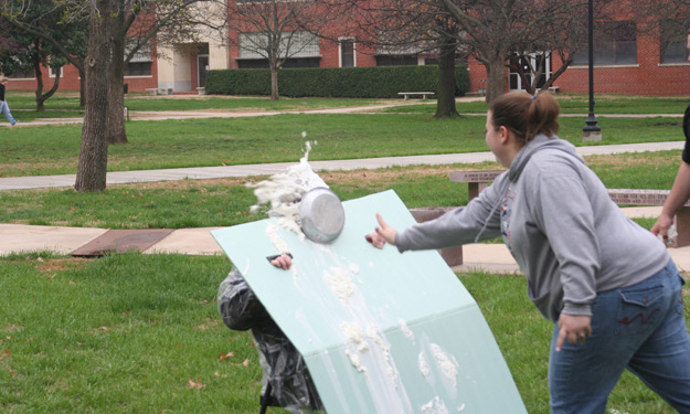 Clay Carley gets pied in the face during the Math Department's Pi Day