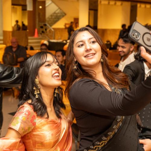 Students taking selfie at Diwali Night