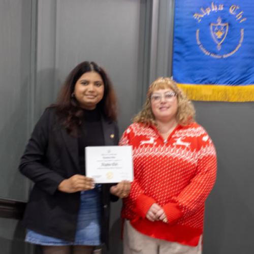 ECU Student being inducted into Alpha Chi