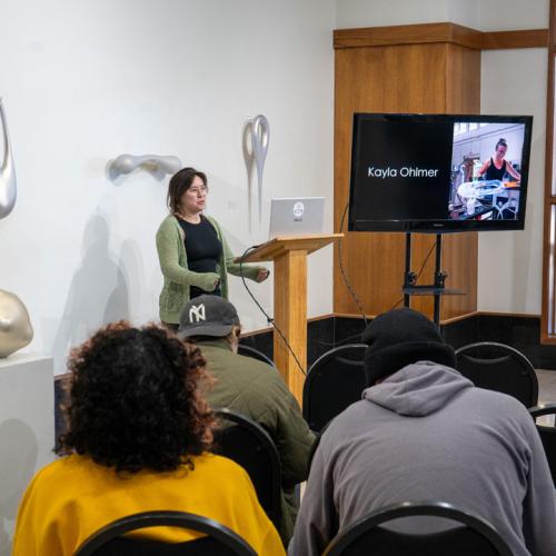 Program Director of Tulsa Glassblowing School, Kayla Ohlmer, speaks to ECU students about her work and experience as an artist and glassblower.