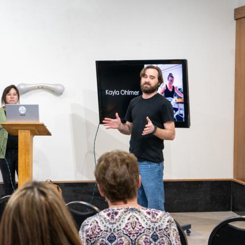 ECU professor, Clint Wright, introduces guest artist Kayla Ohlmer to students.