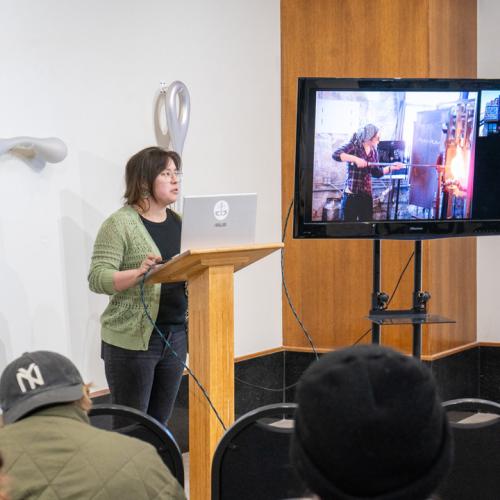 Program Director of Tulsa Glassblowing School, Kayla Ohlmer, speaks to ECU students about her work and experience as an artist and glassblower.