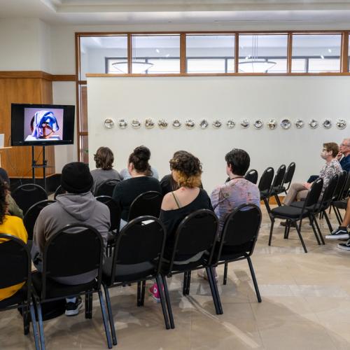 Program Director of Tulsa Glassblowing School, Kayla Ohlmer, speaks to ECU students about her work and experience as an artist and glassblower.