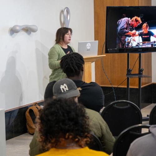 Program Director of Tulsa Glassblowing School, Kayla Ohlmer, speaks to ECU students about her work and experience as an artist and glassblower.