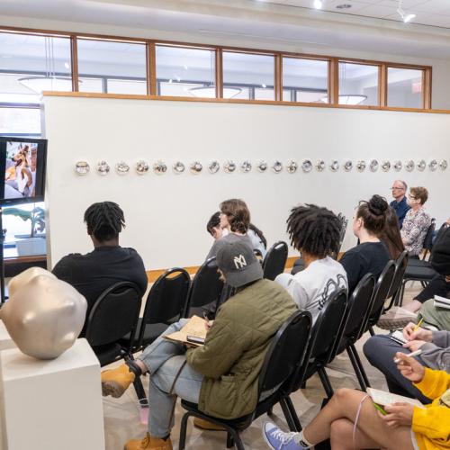 Program Director of Tulsa Glassblowing School, Kayla Ohlmer, speaks to ECU students about her work and experience as an artist and glassblower.