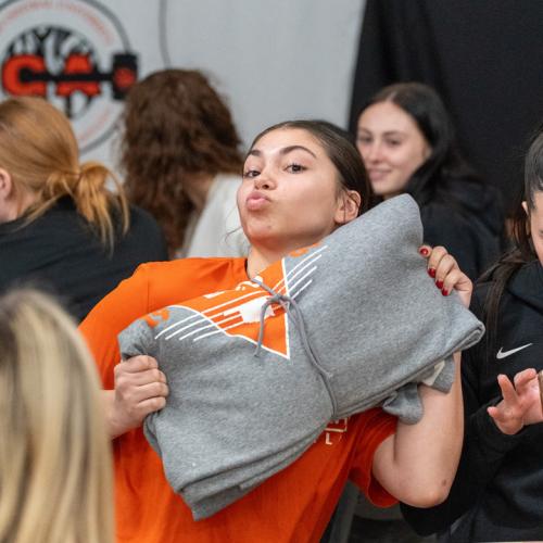  A student poses with her new ECU Tigers sweatshirt blanket.