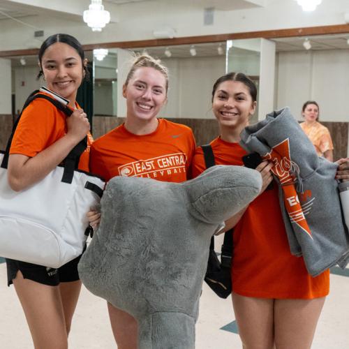 Three students show off their swag after Lucky Tiger Bingo.